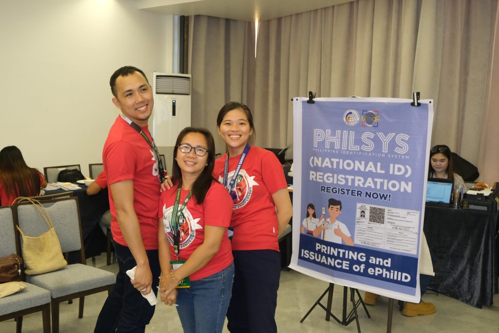 May be an image of 7 people and text that says "PHILSYS PHILIPPINE IDENTIP PICATION (NATIONAL ON SYSTEM REGISTRATION ID) REGISTER REGISTERNOW! NOW! AHNN ERNIVERS ISSUANCE of ePhiliD PRINTING 75 มภกมกด and"